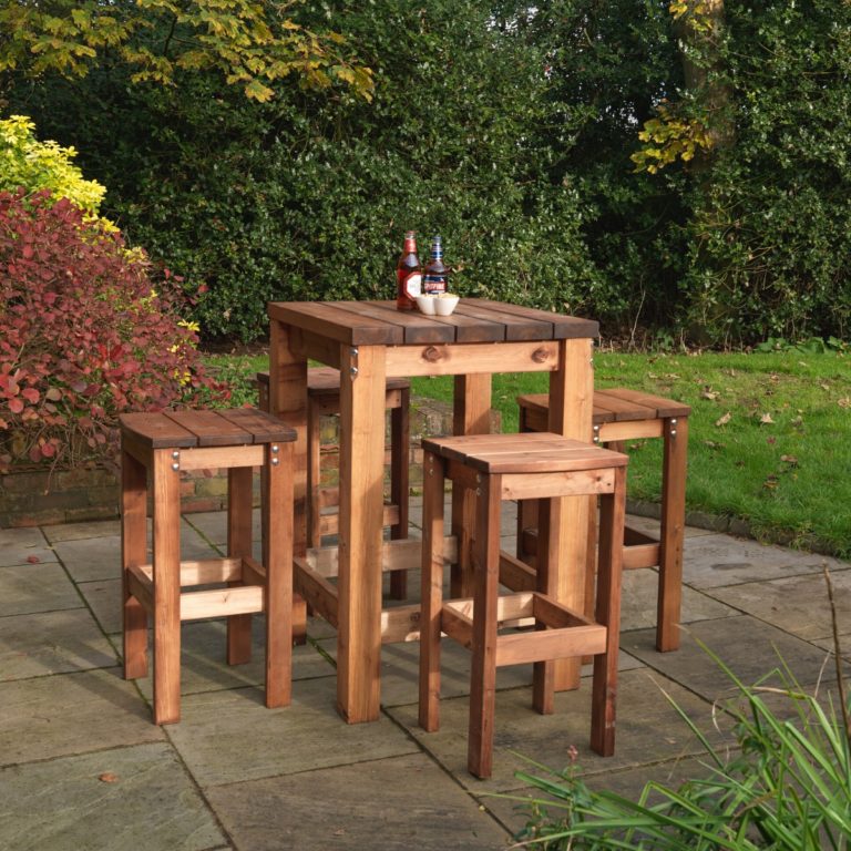 A square wooden poseur table and four bar stools outside on a patio