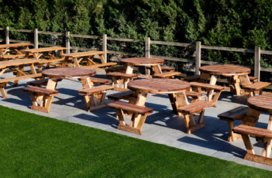 A Frame and Circular Picnic Tables Multiple Sets on Patio