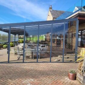 Aluminium shelter with polycarb roof and glass sides at golf club1