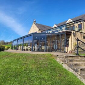 Aluminium shelter with polycarb roof and glass sides at golf club2